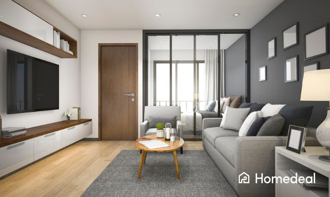 Soggiorno moderno con porta in legno e infissi in vetro a taglio termico che separano gli ambienti interni, ideale per interventi con Bonus Infissi 2025 senza ristrutturazione - Homedeal