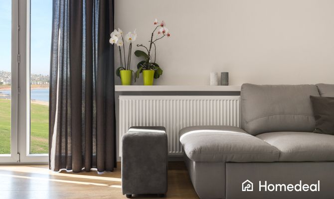 Esempio di ambiente moderno con radiatore efficiente: uno dei benefici concreti del bonus caldaia 2025 - Homedeal